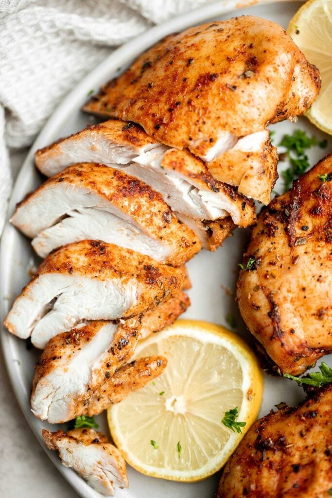 Air fryer chicken breast is crispy on the outside, juicy and tender inside, and packed with flavor in every bite. Quick and easy dinner on busy weeknights. | aheadofthyme.com