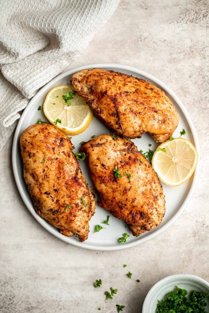 Air fryer chicken breast is crispy on the outside, juicy and tender inside, and packed with flavor in every bite. Quick and easy dinner on busy weeknights. | aheadofthyme.com