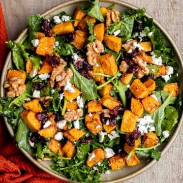 Butternut Squash Salad is a fresh and cozy fall salad with roasted squash, kale, walnuts, cranberries, and feta tossed in lemon dressing. Perfect for fall. | aheadofthyme.com