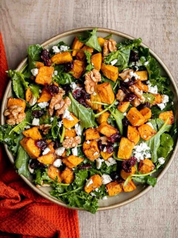 Butternut Squash Salad is a fresh and cozy fall salad with roasted squash, kale, walnuts, cranberries, and feta tossed in lemon dressing. Perfect for fall. | aheadofthyme.com