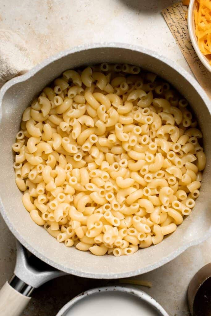 Classic Baked Mac and Cheese is creamy, cheesy, and topped with golden garlic breadcrumbs. The ultimate comfort food, ready in under an hour. | aheadofthyme.com
