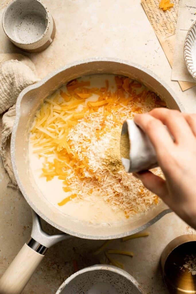 Classic Baked Mac and Cheese is creamy, cheesy, and topped with golden garlic breadcrumbs. The ultimate comfort food, ready in under an hour. | aheadofthyme.com