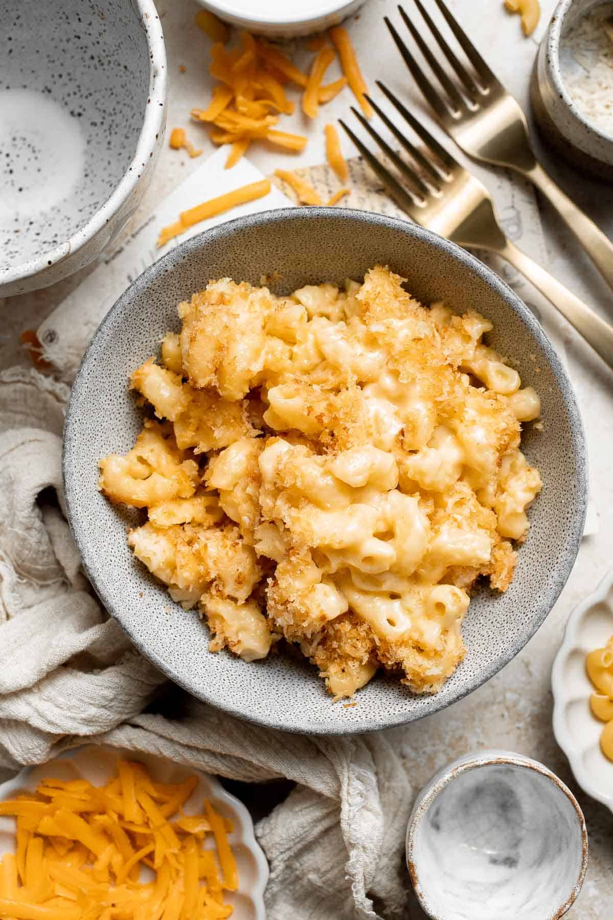 Classic Baked Mac and Cheese is creamy, cheesy, and topped with golden garlic breadcrumbs. The ultimate comfort food, ready in under an hour. | aheadofthyme.com