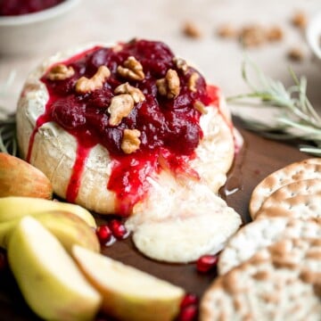 Cranberry baked brie is a sweet and savory appetizer you need to try this holiday season. It's quick and easy, melty and gooey, and so delicious. | aheadofthyme.com