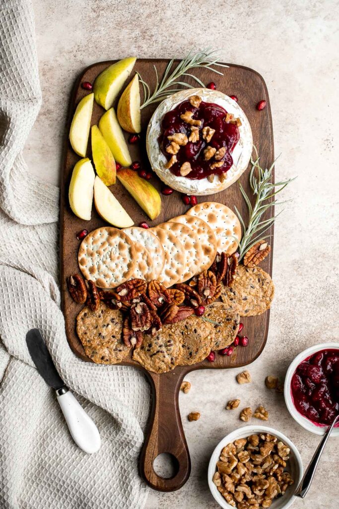 Cranberry baked brie is a sweet and savory appetizer you need to try this holiday season. It's quick and easy, melty and gooey, and so delicious. | aheadofthyme.com