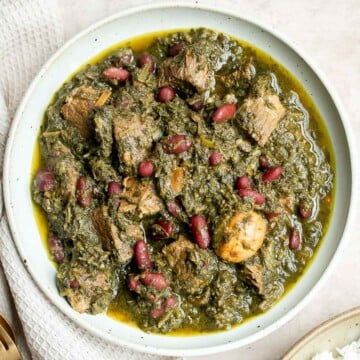 Ghormeh sabzi is a classic traditional Persian herb stew with beef or lamb, fresh herbs, and kidney beans, that's slowly cooked, developing so much flavor. | aheadofthyme.com