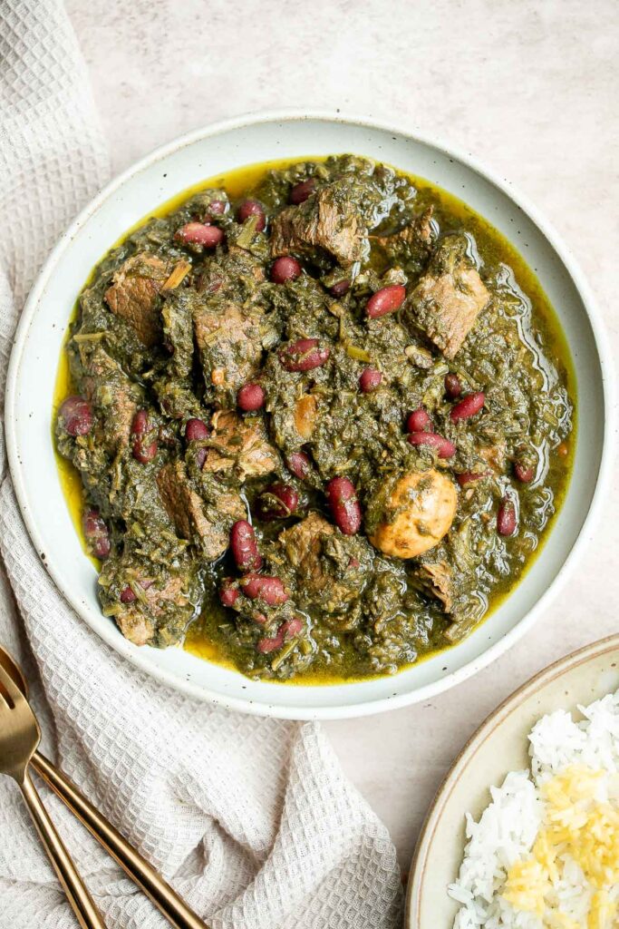 Ghormeh sabzi is a classic traditional Persian herb stew with beef or lamb, fresh herbs, and kidney beans, that's slowly cooked, developing so much flavor. | aheadofthyme.com
