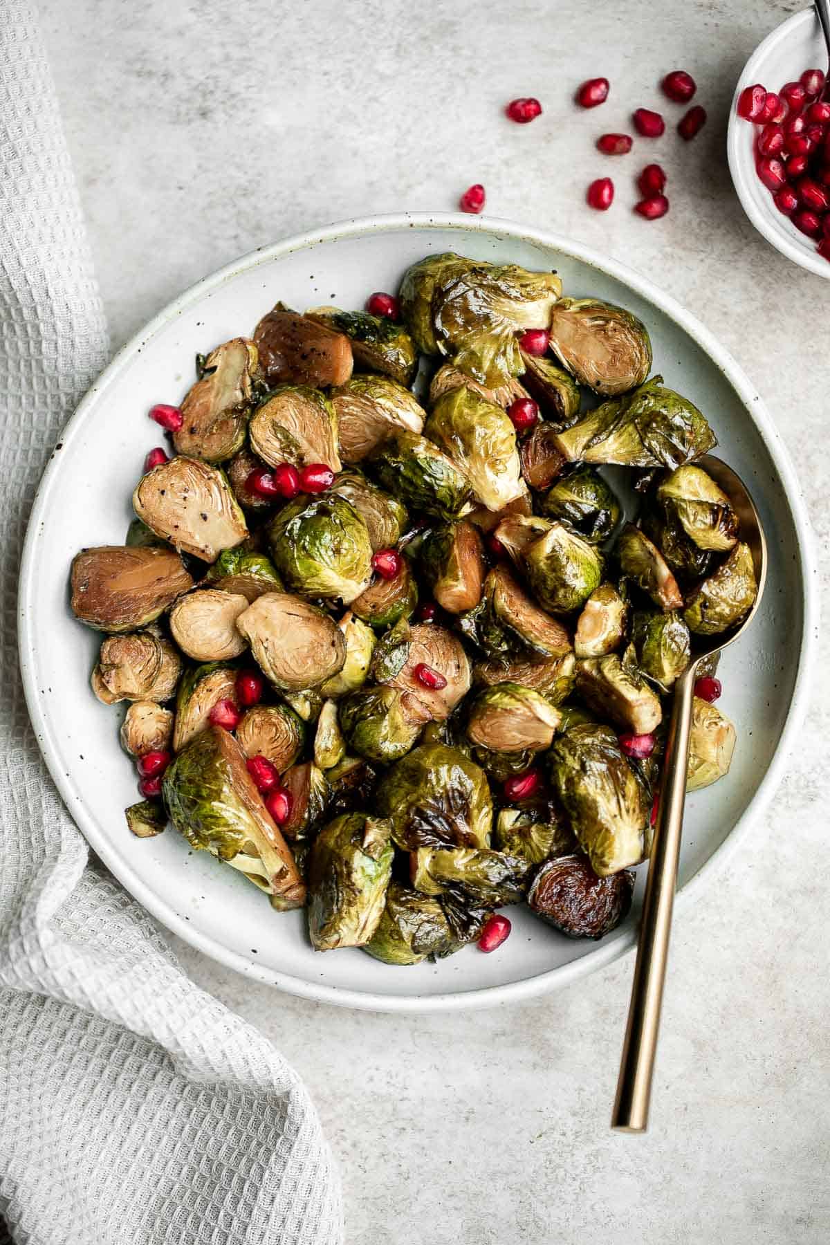 Easy honey balsamic Brussels sprouts are a sweet savory side dish that's roasted until tender and caramelized, and coated in a delicious flavourful glaze. | aheadofthyme.com