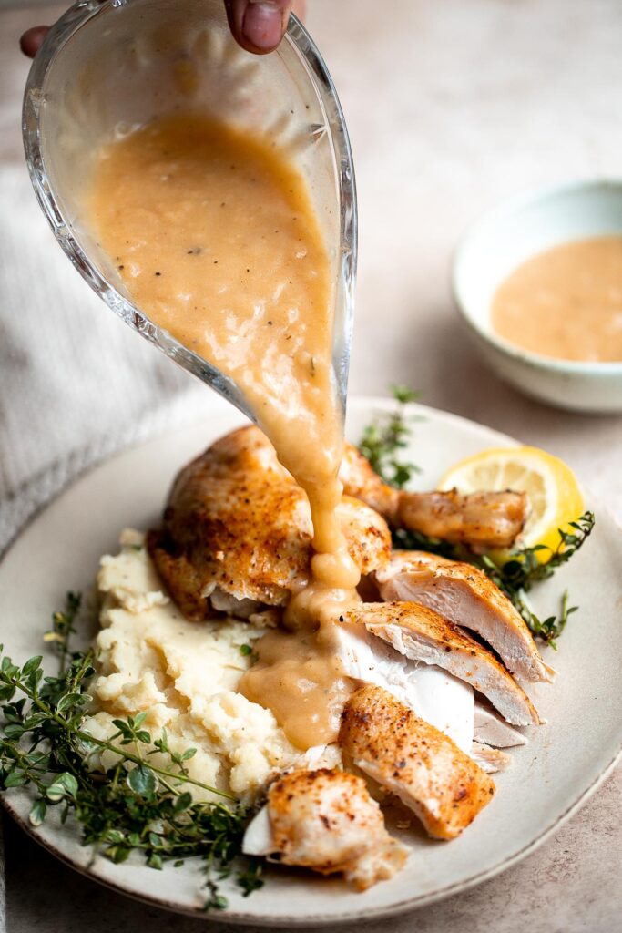 Instant pot whole chicken with gravy is tender, juicy, and flavorful. It's the fastest way to cook a whole rotisserie chicken for dinner in just 40 minutes. | aheadofthyme.com