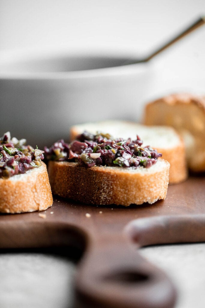 Olive tapenade is a delicious, flavorful, easy dip that comes together in minutes, made with the perfect combination of sharp, tangy, salty, and savory. | aheadofthyme.com