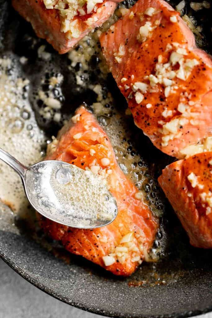 Pan-seared garlic butter salmon is tender, flaky, and flavorful. An easy 20-minute recipe with lemon and parsley, perfect for weeknights. | aheadofthyme.com