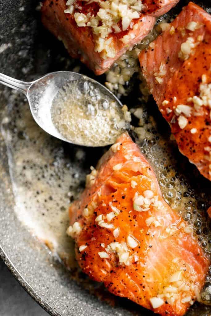Pan-seared garlic butter salmon is tender, flaky, and flavorful. An easy 20-minute recipe with lemon and parsley, perfect for weeknights. | aheadofthyme.com