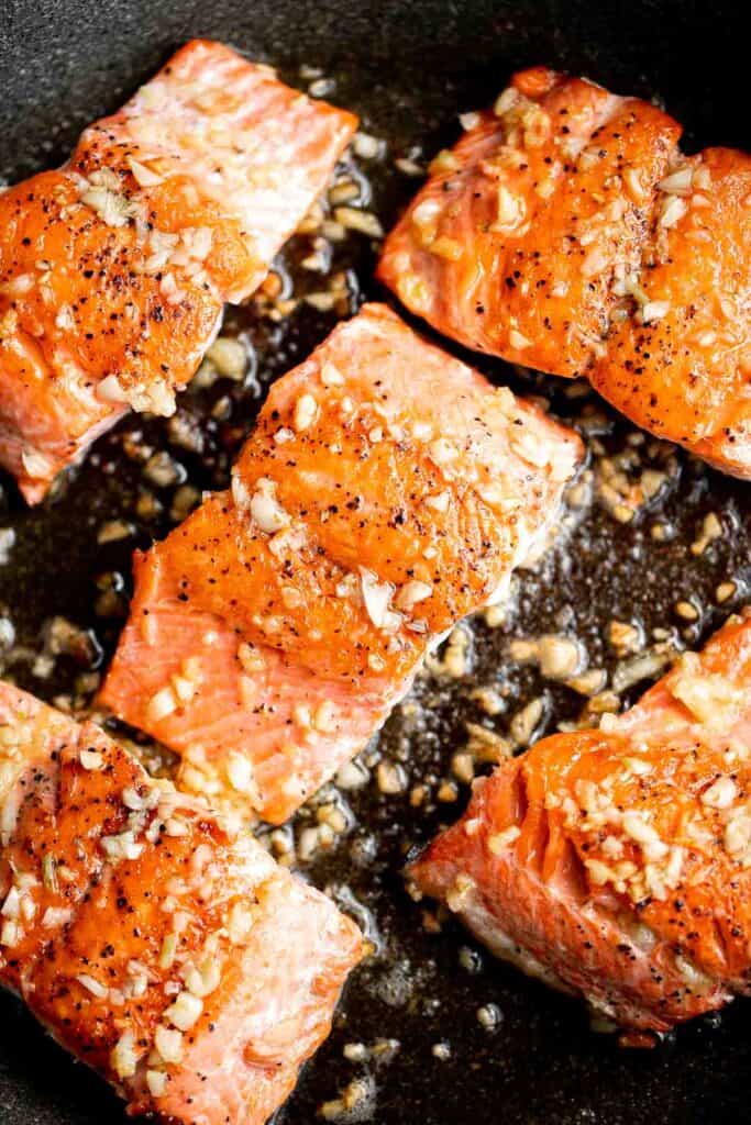 Pan-seared garlic butter salmon is tender, flaky, and flavorful. An easy 20-minute recipe with lemon and parsley, perfect for weeknights. | aheadofthyme.com