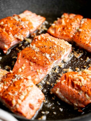 Pan-seared garlic butter salmon is tender, flaky, and flavorful. An easy 20-minute recipe with lemon and parsley, perfect for weeknights. | aheadofthyme.com