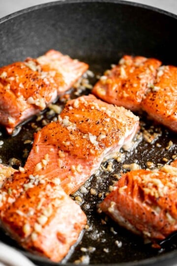 Pan-seared garlic butter salmon is tender, flaky, and flavorful. An easy 20-minute recipe with lemon and parsley, perfect for weeknights. | aheadofthyme.com