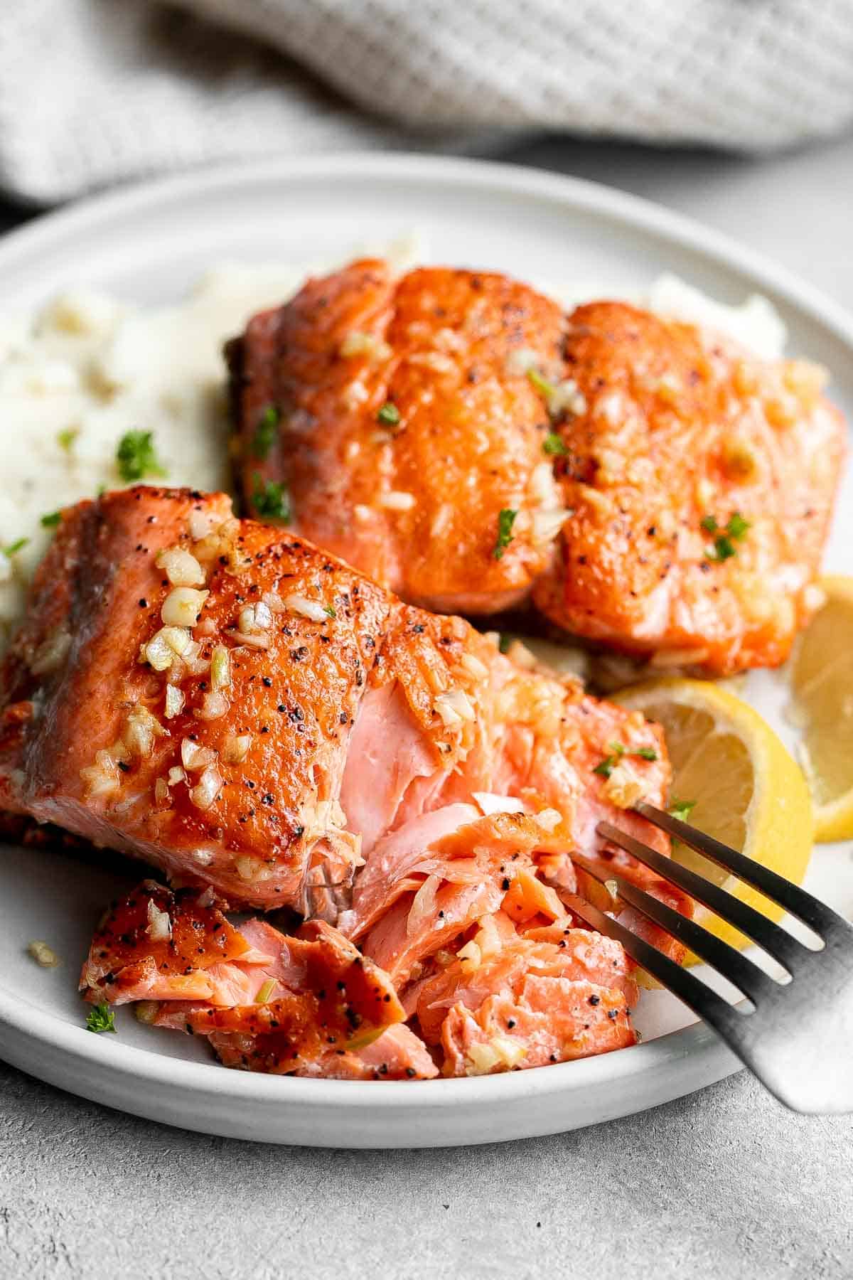 Pan-seared garlic butter salmon is tender, flaky, and flavorful. An easy 20-minute recipe with lemon and parsley, perfect for weeknights. | aheadofthyme.com