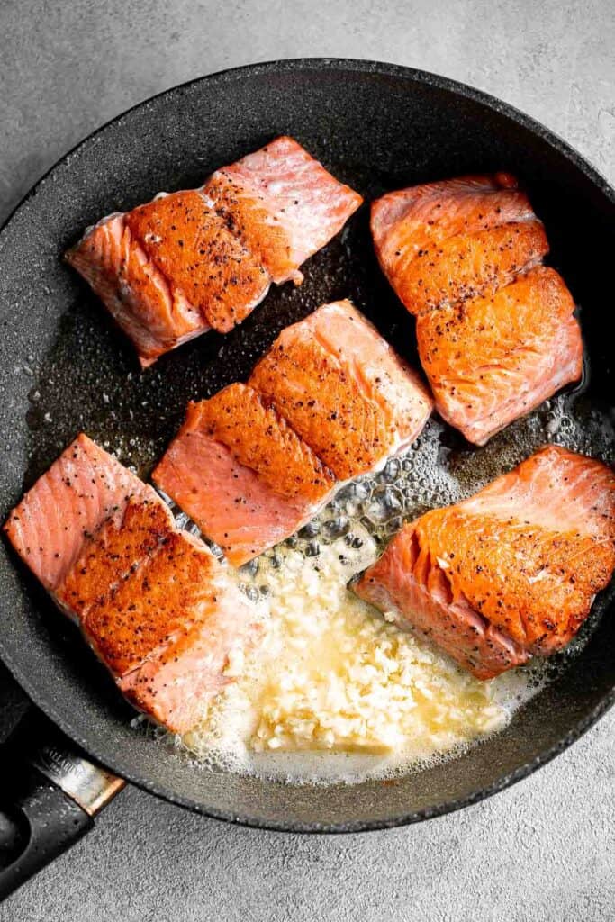 Pan-seared garlic butter salmon is tender, flaky, and flavorful. An easy 20-minute recipe with lemon and parsley, perfect for weeknights. | aheadofthyme.com
