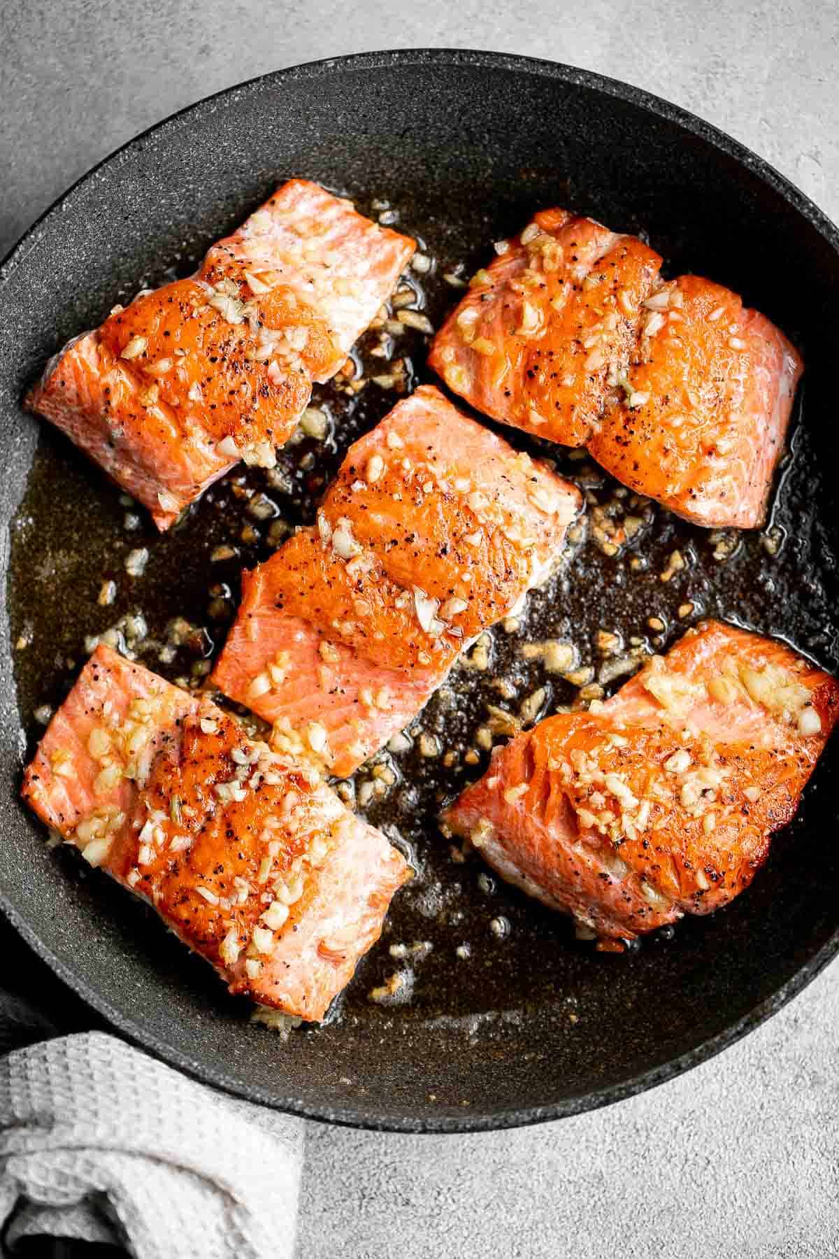 Pan-seared garlic butter salmon is tender, flaky, and flavorful. An easy 20-minute recipe with lemon and parsley, perfect for weeknights. | aheadofthyme.com