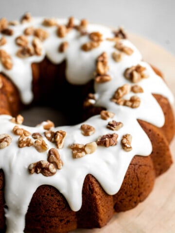 Pumpkin bundt cake with cream cheese icing is a perfect fall dessert to serve this year — super moist inside, with a perfect golden brown crumby crust. | aheadofthyme.com