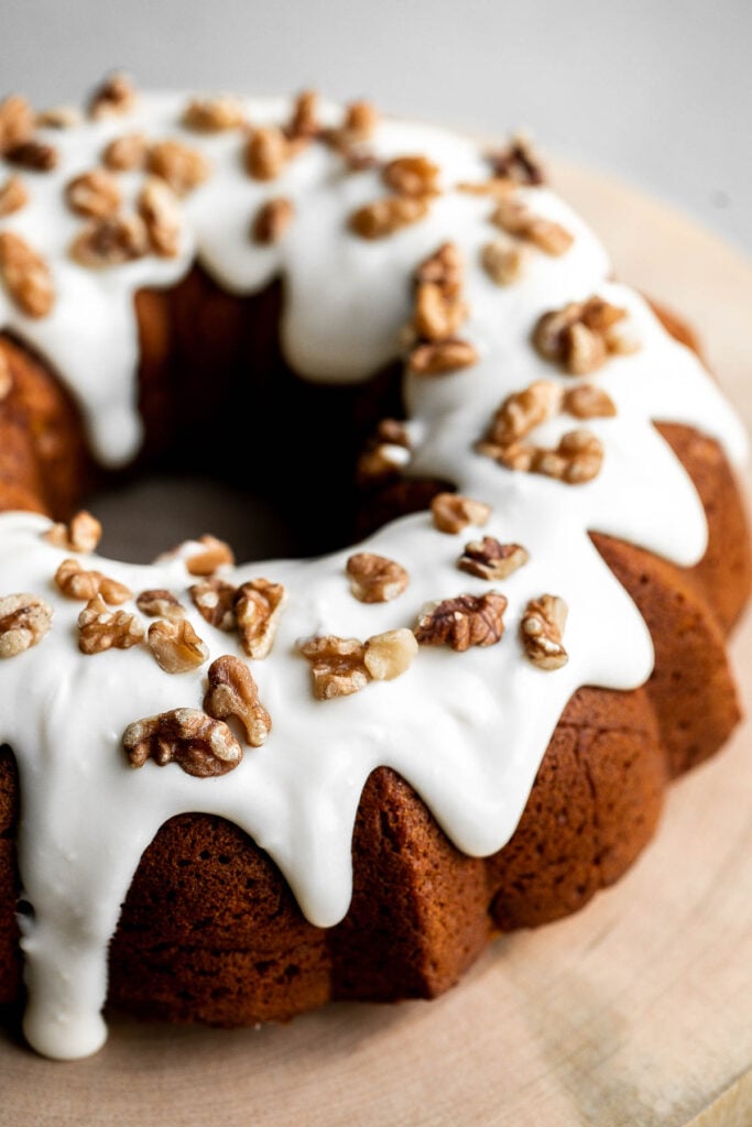 Pumpkin bundt cake with cream cheese icing is a perfect fall dessert to serve this year — super moist inside, with a perfect golden brown crumby crust. | aheadofthyme.com