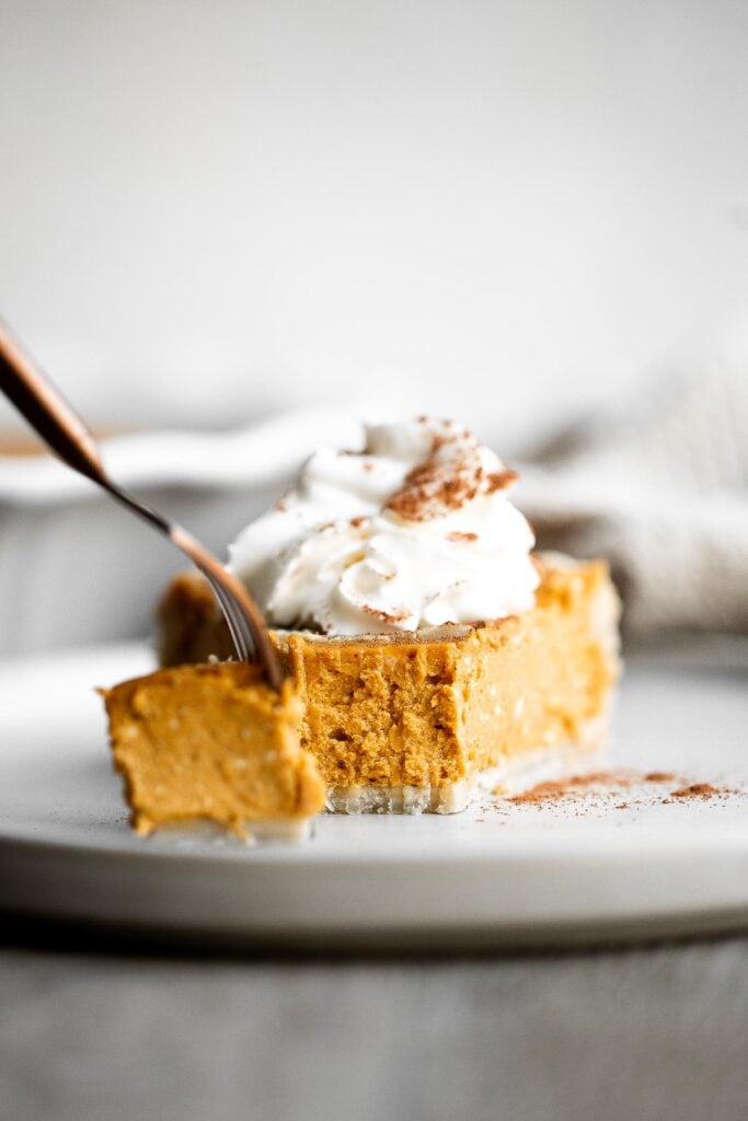 Pumpkin mascarpone pie is a warm and cozy holiday dessert that is incredibly easy to make with just minutes of prep work before popping into the oven. | aheadofthyme.com