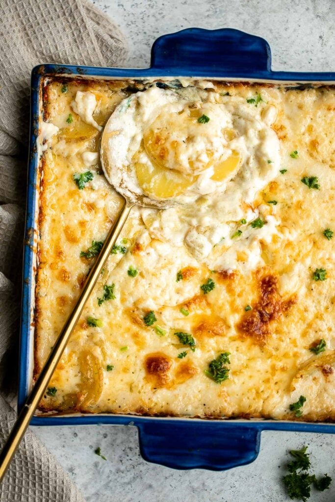 Scalloped potatoes are a creamy, cheesy, indulgent side dish that will make cheese lovers swoon. Every bite is savory, rich, comforting, and delicious. | aheadofthyme.com