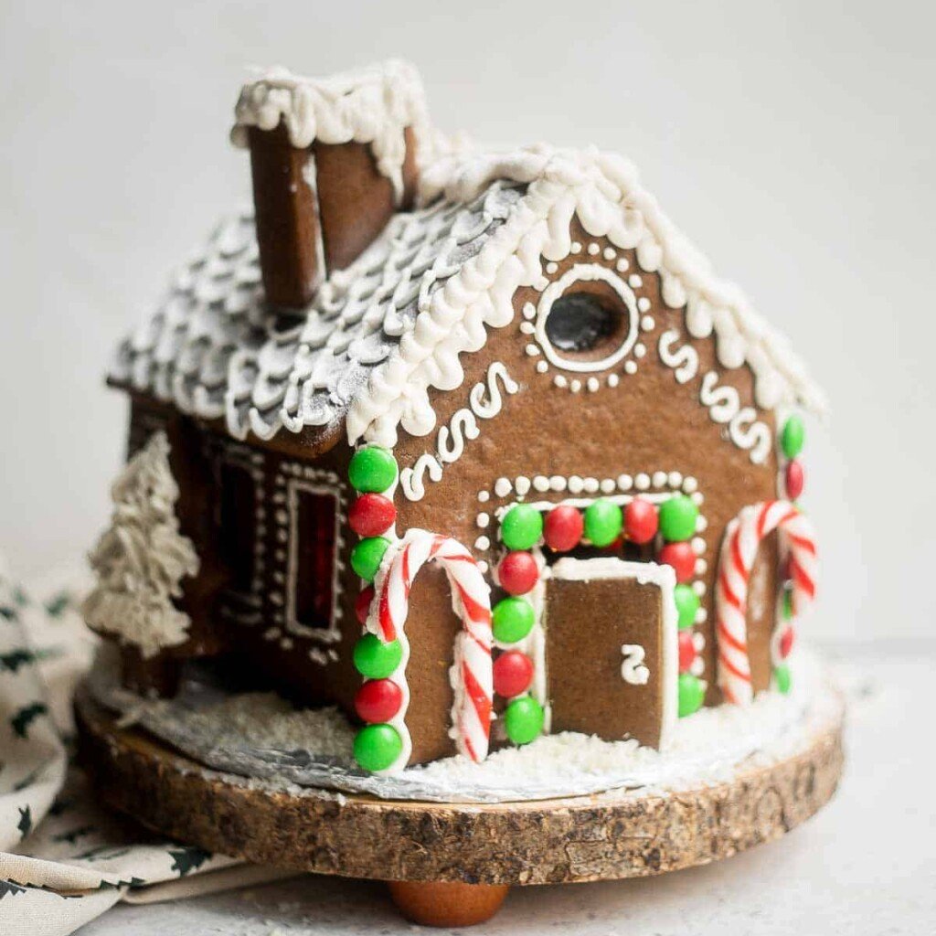 This gingerbread house recipe with template is easy to make, fun to decorate, and delicious - soft and chewy, yet crunchy and sturdy with crisp edges. | aheadofthyme.com