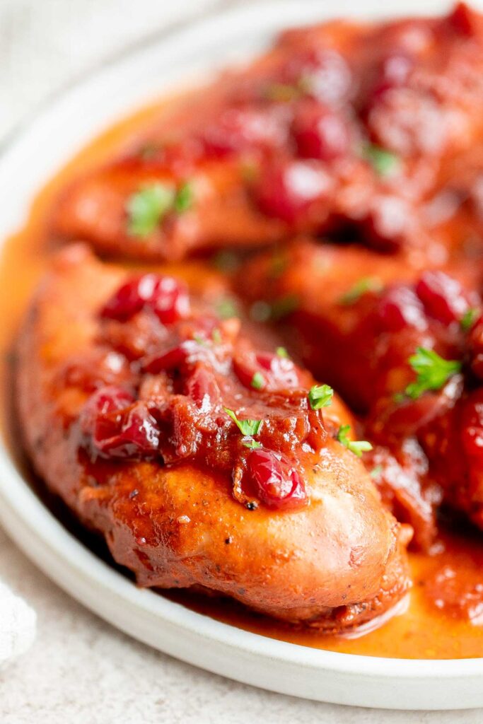 Instant pot cranberry chicken is sweet, tart, savory, and delicious. Make this chicken dinner in the pressure cooker in just 30 minutes. So quick and easy! | aheadofthyme.com