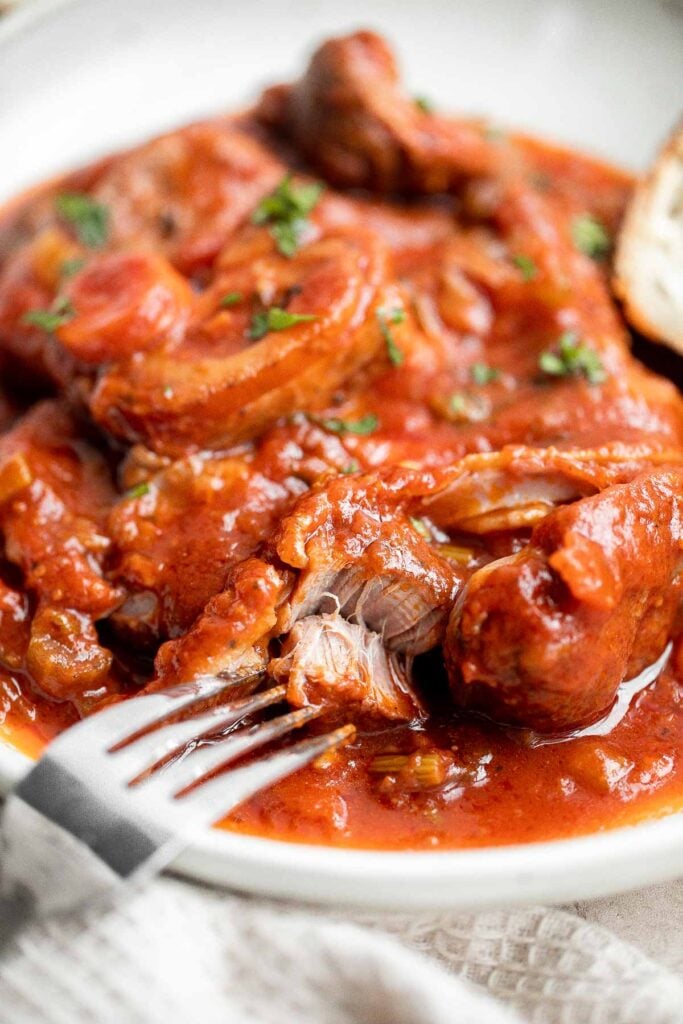 Instant pot osso buco is a delicious, classic Italian recipe with braised veal shanks stewed with vegetables in a thick, savory red wine and tomato sauce. | aheadofthyme.com