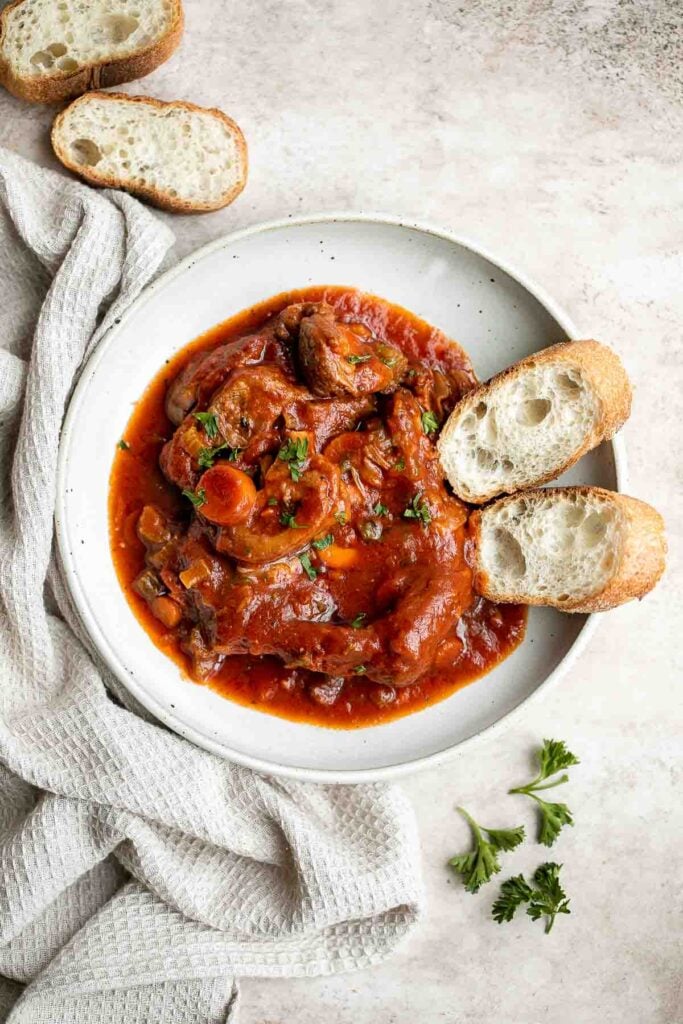 Instant pot osso buco is a delicious, classic Italian recipe with braised veal shanks stewed with vegetables in a thick, savory red wine and tomato sauce. | aheadofthyme.com