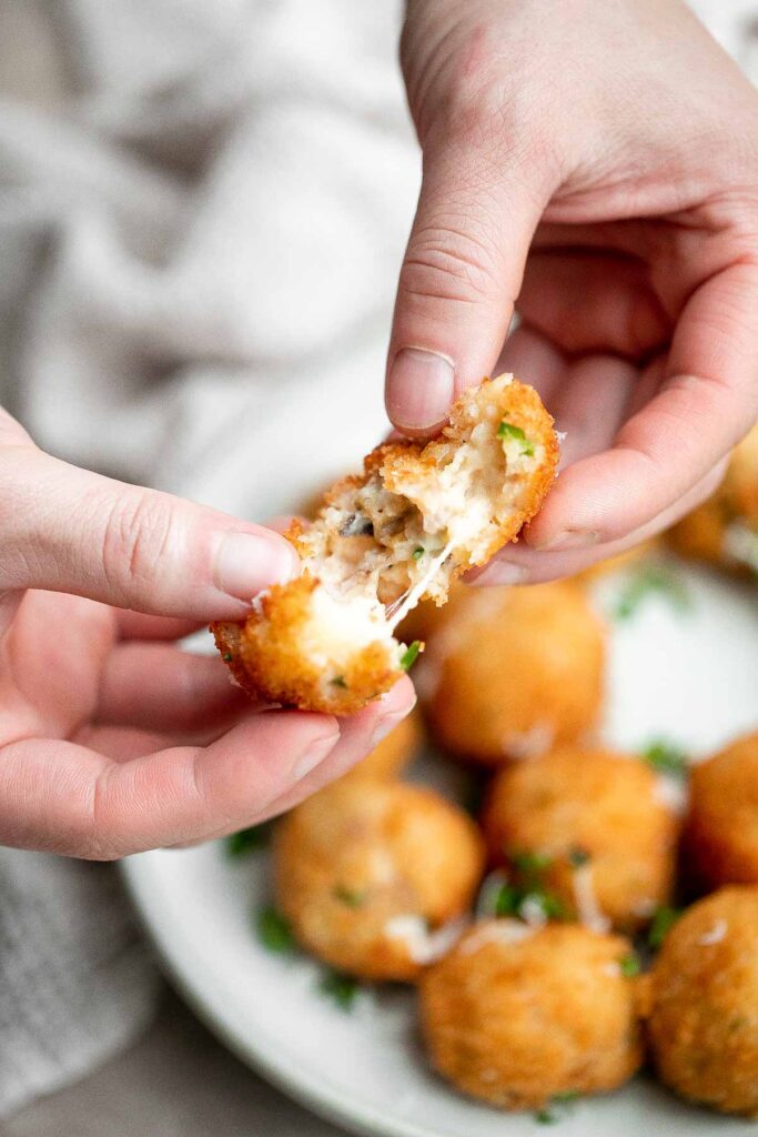 Mashed potato balls are a delicious appetizer that is crisp on the outside and soft, tender, and cheesy inside. Best way to use leftover mashed potatoes! | aheadofthyme.com