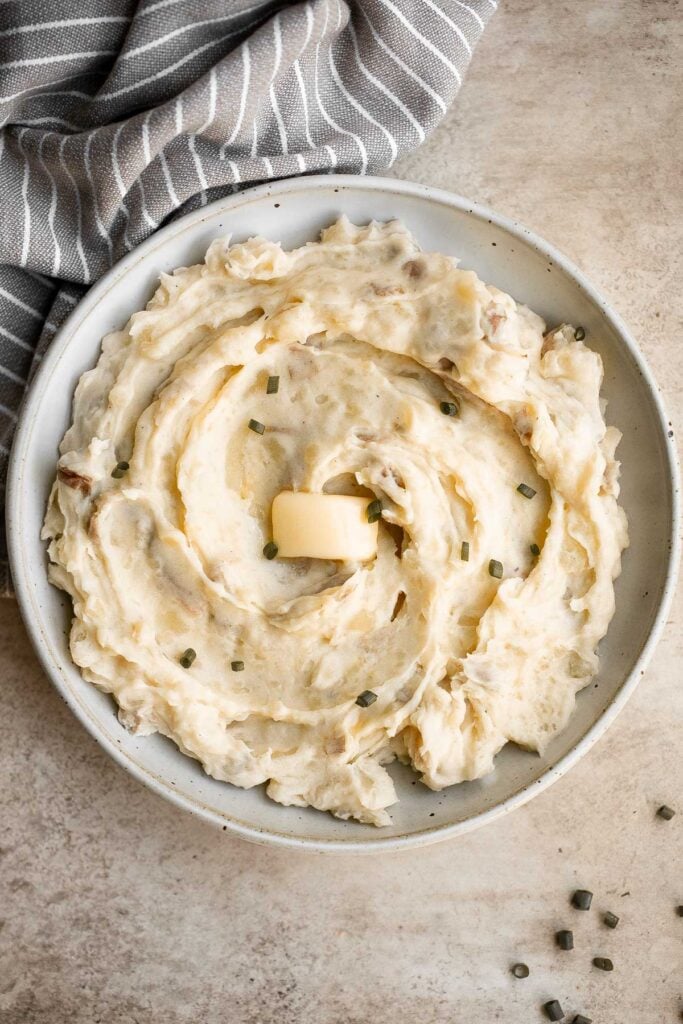 Mashed red potatoes are a simple and easy side dish with elegant flavor and plenty of nutrition. They are creamy, comforting, and have the best texture. | aheadofthyme.com