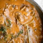 Vegetarian mushroom gravy is creamy, savory and thick, easy to make, loaded with flavor, and pairs well with everything! Make it vegan and dairy-free too. | aheadofthyme.com