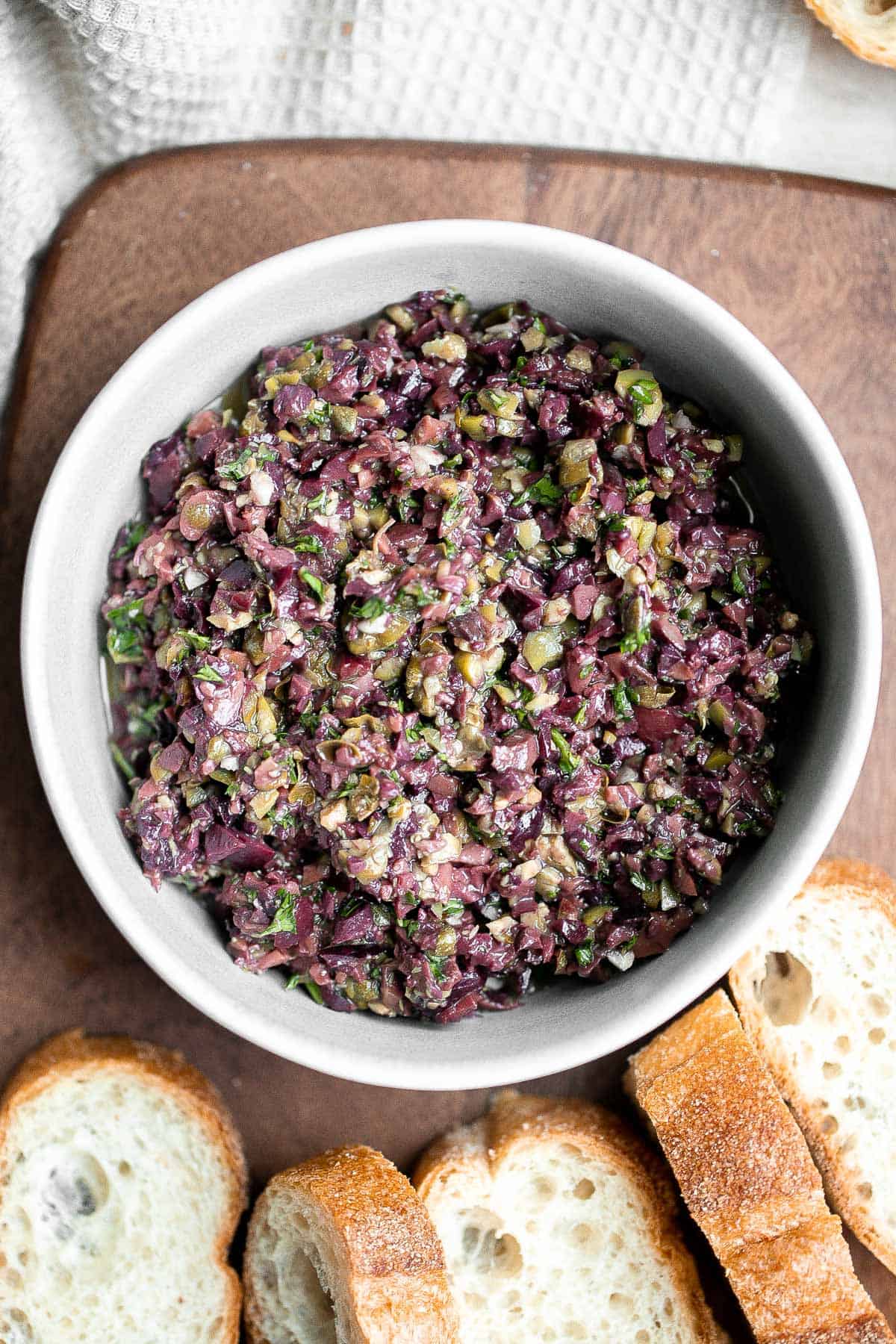 Olive tapenade is a delicious, flavorful, easy dip that comes together in minutes, made with the perfect combination of sharp, tangy, salty, and savory. | aheadofthyme.com