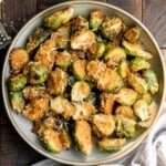 Parmesan crusted Brussels sprouts are a quick, easy, delicious side dish that's perfectly crispy outside and soft and tender inside. Ready in 30 minutes. | aheadofthyme.com