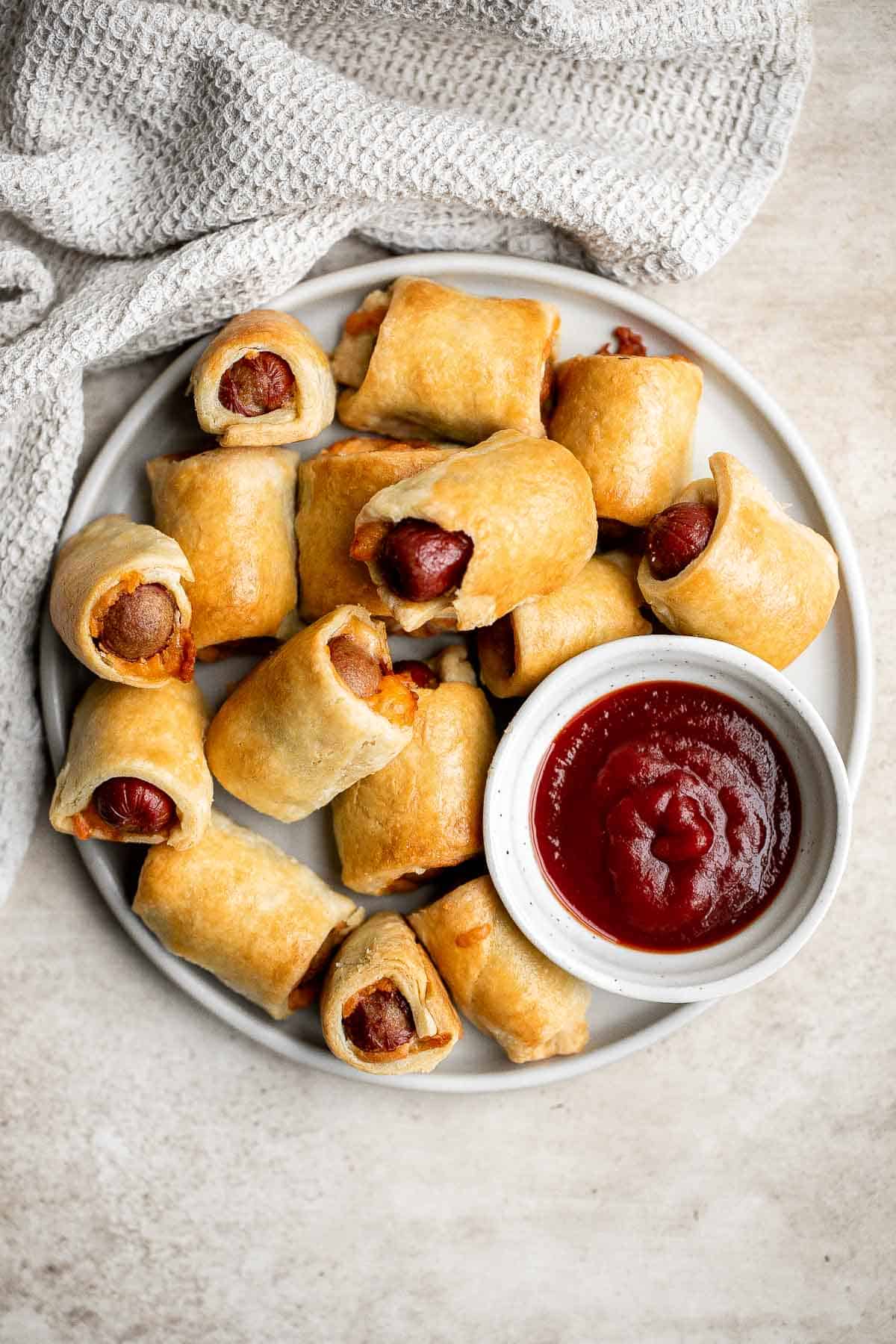 Pigs in a blanket from scratch are a delicious and easy appetizer or snack to make for your next party or gathering — juicy, cheesy, flaky, and buttery. | aheadofthyme.com