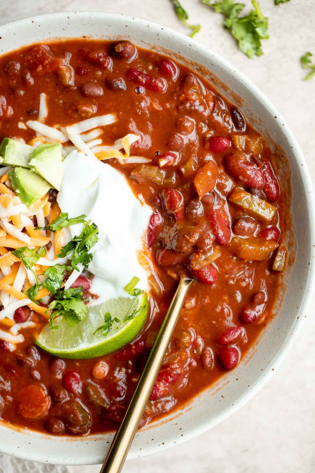 Easy one pot vegetarian chili is the perfect warm and cozy comfort meal — it’s hearty, filling, wholesome, flavorful, delicious, and loaded with protein. | aheadofthyme.com