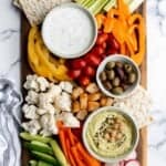 This homemade veggie tray is a quick easy healthy snack or appetizer to make for your next party, with a variety of colorful vegetables and delicious dips. | aheadofthyme.com