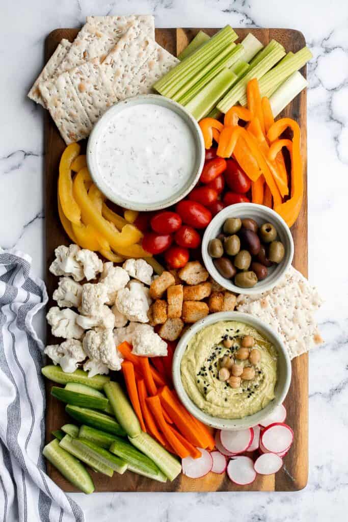 This homemade veggie tray is a quick easy healthy snack or appetizer to make for your next party, with a variety of colorful vegetables and delicious dips. | aheadofthyme.com