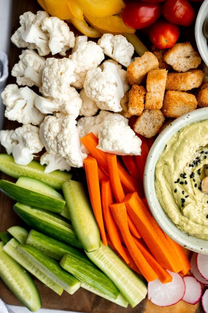 This homemade veggie tray is a quick easy healthy snack or appetizer to make for your next party, with a variety of colorful vegetables and delicious dips. | aheadofthyme.com