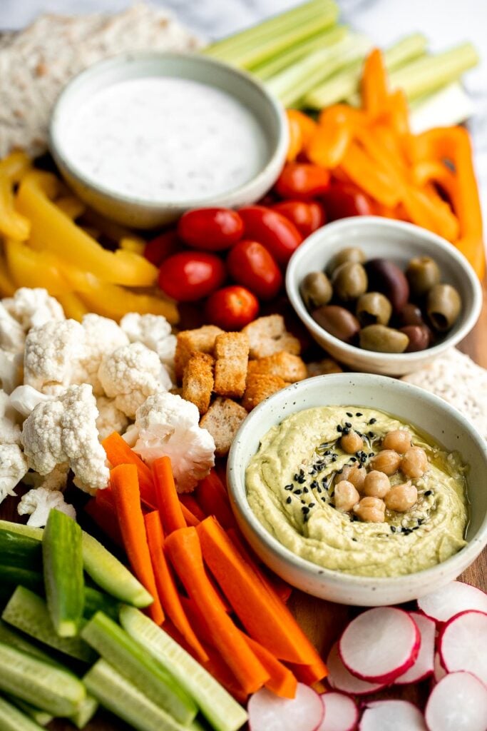 This homemade veggie tray is a quick easy healthy snack or appetizer to make for your next party, with a variety of colorful vegetables and delicious dips. | aheadofthyme.com