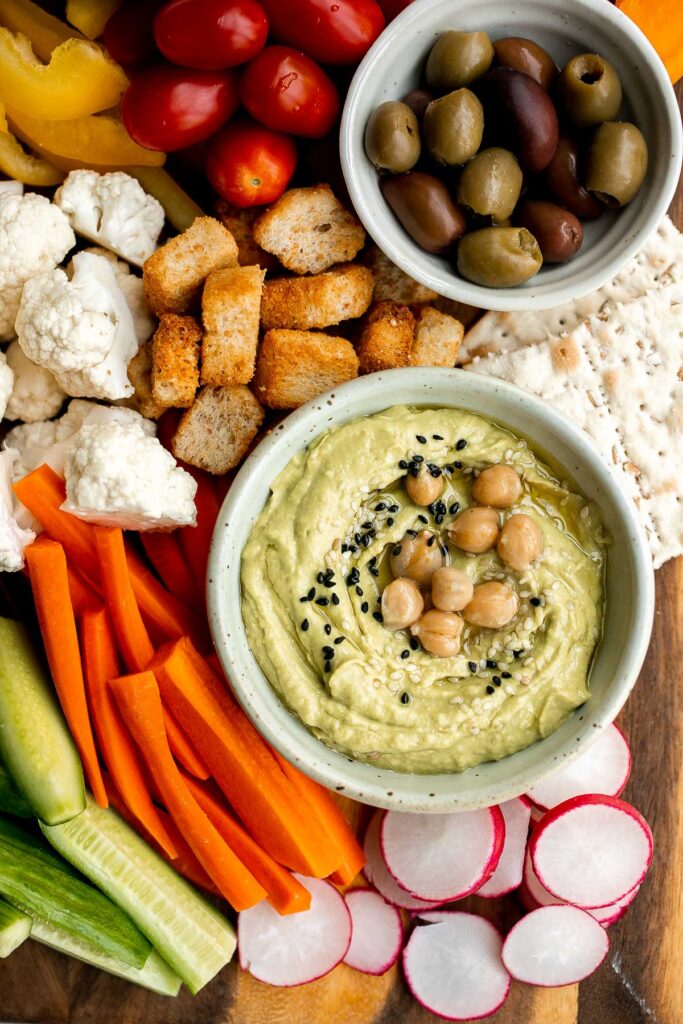 This homemade veggie tray is a quick easy healthy snack or appetizer to make for your next party, with a variety of colorful vegetables and delicious dips. | aheadofthyme.com