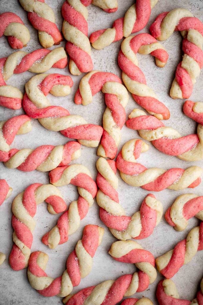 Candy cane cookies are fun, festive holiday cookies with a red and white twist, buttery, crumbly, and sugary with peppermint for a classic Christmas flavor. | aheadofthyme.com