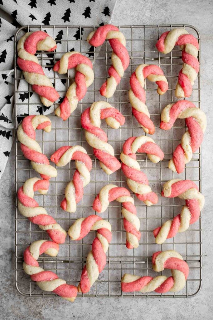 Candy cane cookies are fun, festive holiday cookies with a red and white twist, buttery, crumbly, and sugary with peppermint for a classic Christmas flavor. | aheadofthyme.com