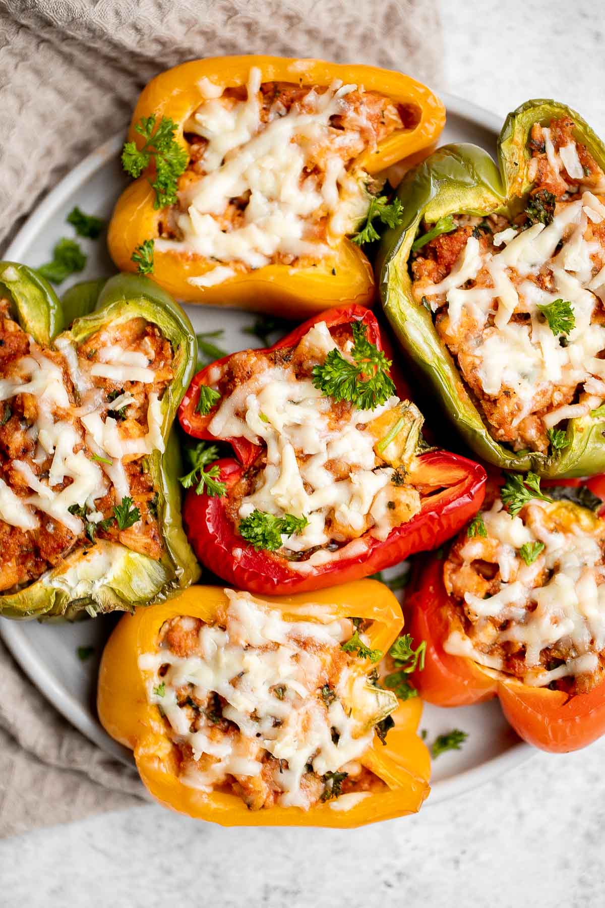 Chicken parmesan stuffed peppers are delicious, flavorful, healthy, and filling, and combines two all-time favorites. Great for meal prep and freezes well. | aheadofthyme.com