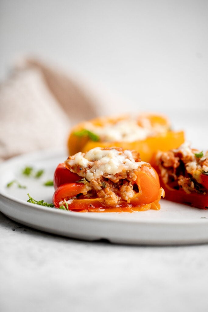 Chicken parmesan stuffed peppers are delicious, flavorful, healthy, and filling, and combines two all-time favorites. Great for meal prep and freezes well. | aheadofthyme.com