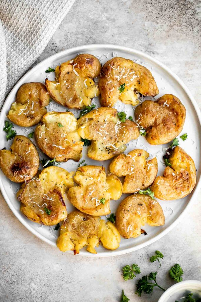 These crispy smashed potatoes are the perfect side dish. They’re easy to make, crispy on the outside, tender and fluffy on the inside, and so flavorful. | aheadofthyme.com