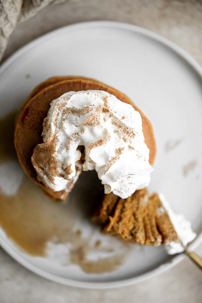 Soft and fluffy gingerbread pancakes are festive and loaded with holiday spices for the perfect breakfast on a winter morning or Christmas Day. | aheadofthyme.com