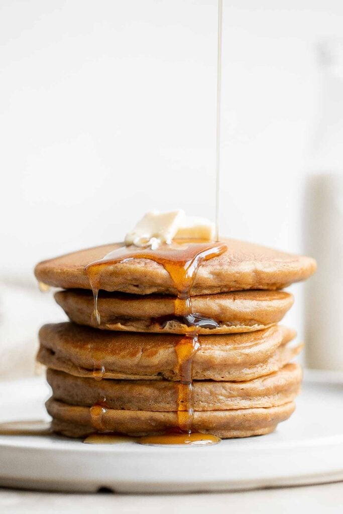 Soft and fluffy gingerbread pancakes are festive and loaded with holiday spices for the perfect breakfast on a winter morning or Christmas Day. | aheadofthyme.com