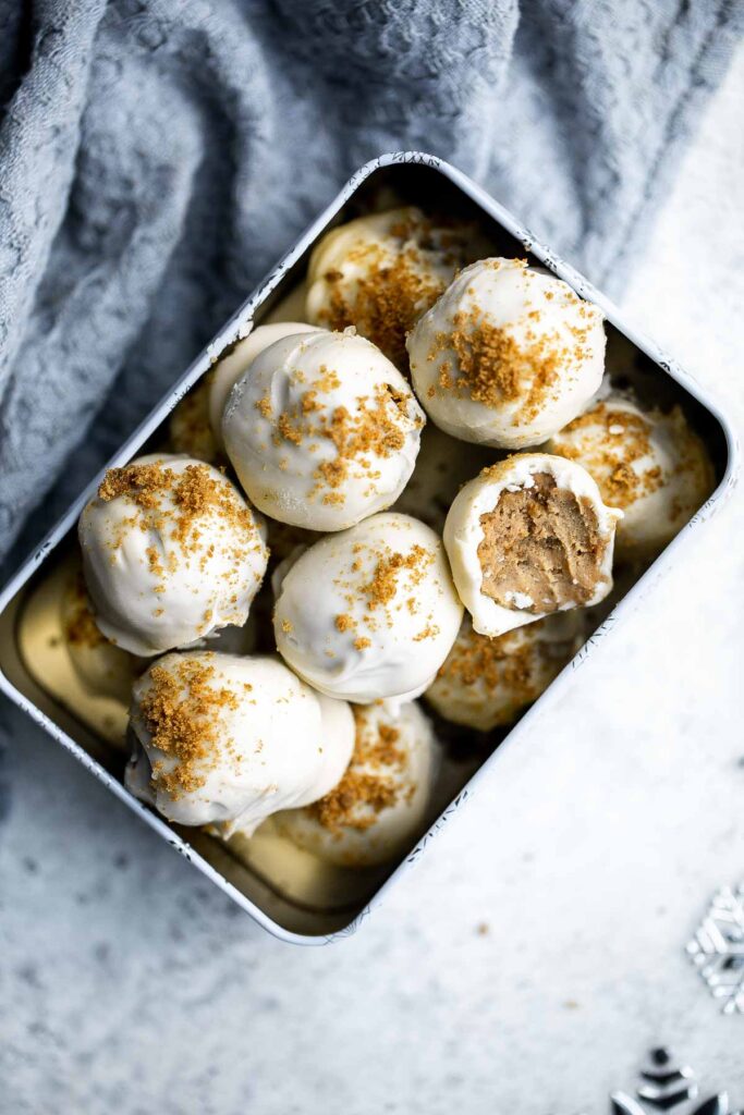 No bake gingerbread truffles with white chocolate are easy to make with just 3 simple ingredients including leftover gingersnaps. Perfect for the holidays. | aheadofthyme.com